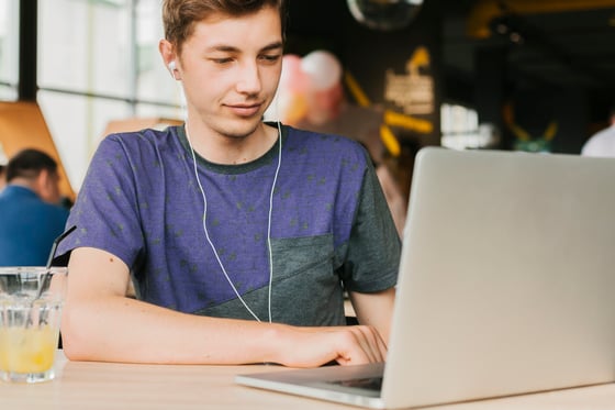 teenage boy using a laptop